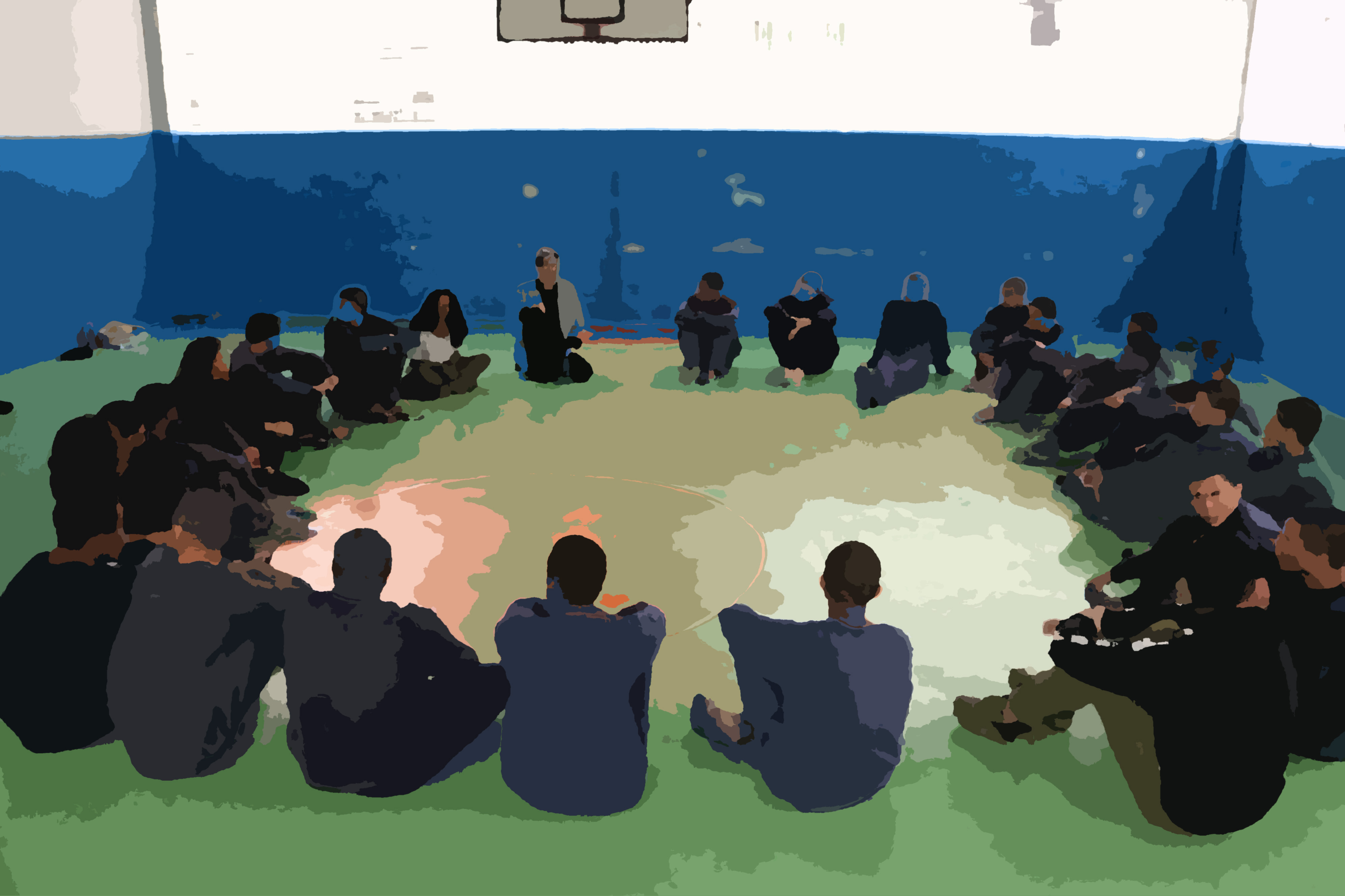 Foto colorida borrada mostrando os jovens da Fundação Casa sentados em círculo